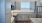 a kitchen with gray cabinets