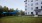 a large building with a lawn
