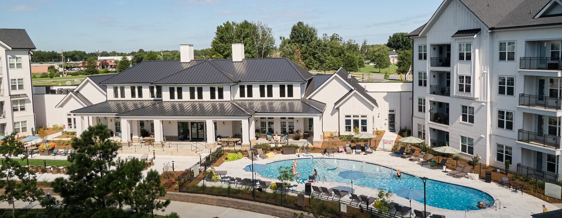 Resort-style swimming pool with lounge seating
