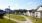 a row of houses with a lawn and a light
